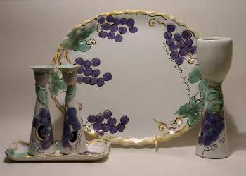 Kiddush cup, challah plate, shabbat candlesticks in a grape design